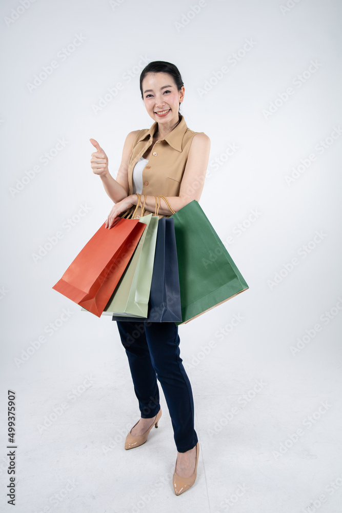 Woman holding paper bags on white background. Woman holding paper bags on white background.
