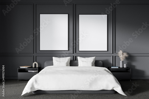 Grey bedroom interior with bed and nightstand with decoration. Mockup frames photo