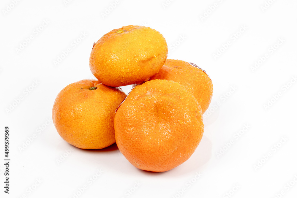 orange isolated in black background - shot in studio lighting. orange isolated in black background - shot in studio lighting.