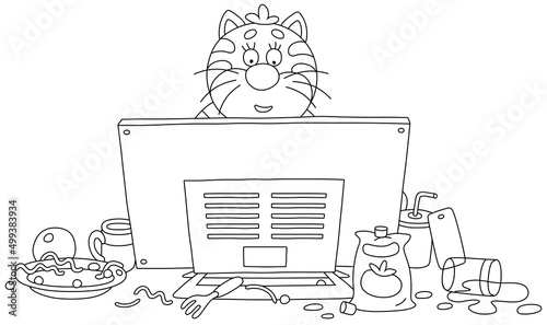 Funny plump cat gamer playing a very interesting computer game and intently looking at a monitor among a mess on its desktop, black and white vector cartoon for a coloring book page