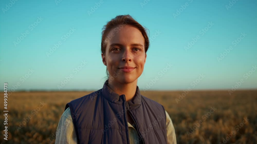 Portrait smiling farmer posing at grain field. Beautiful rural landscape view. Portrait smiling farmer posing at grain field. Beautiful rural landscape view.