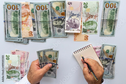 person counting money making calculations