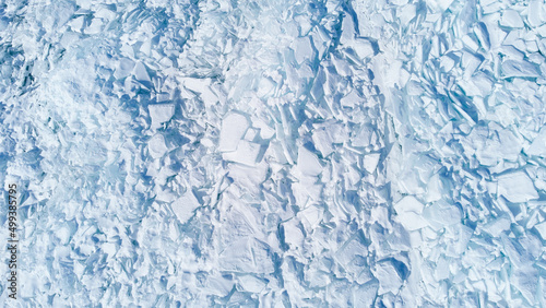 Texture of beautiful white broken ice of Lake Baikal, Siberia, Russia. View from above.