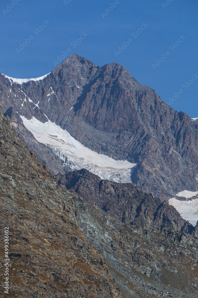 The peaks and glaciers of the Bernina group: one of the mountains of the Alps that exceeds 4000 meters, near the village of Chiesa in Valmalenco, Lombardy, Italy - September 2021.