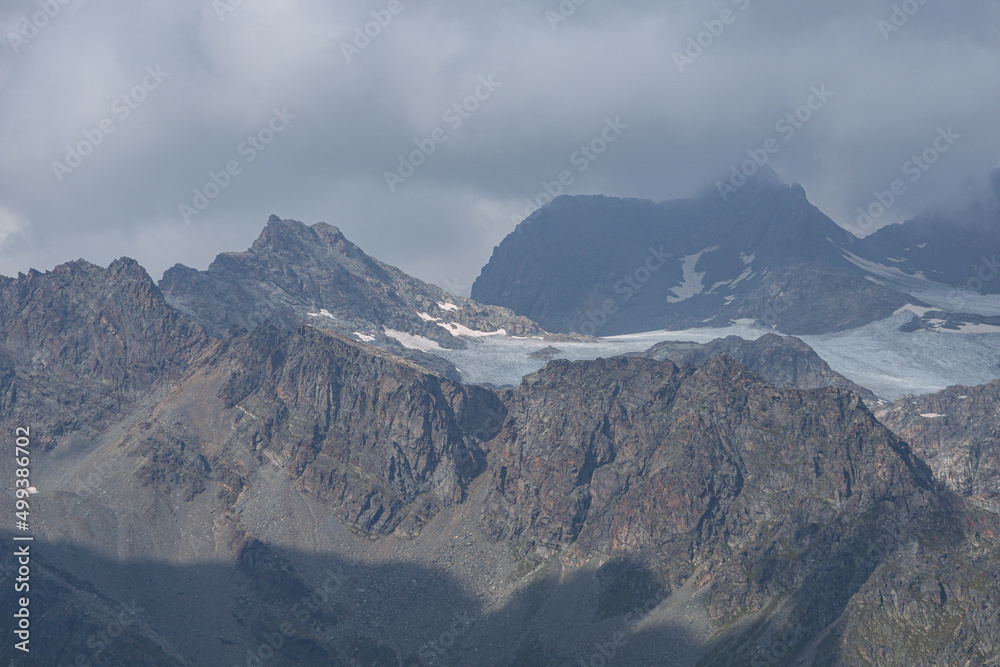 The peaks and glaciers of the Bernina group: one of the mountains of the Alps that exceeds 4000 meters, near the village of Chiesa in Valmalenco, Lombardy, Italy - September 2021.