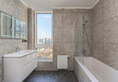  restroom with large view window  toilet and washbasin with large mirror