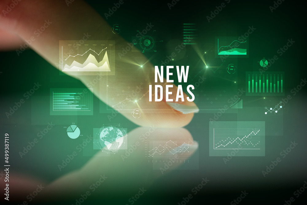 Finger touching tablet with business graphs and icons concept Finger touching tablet with business graphs and icons concept