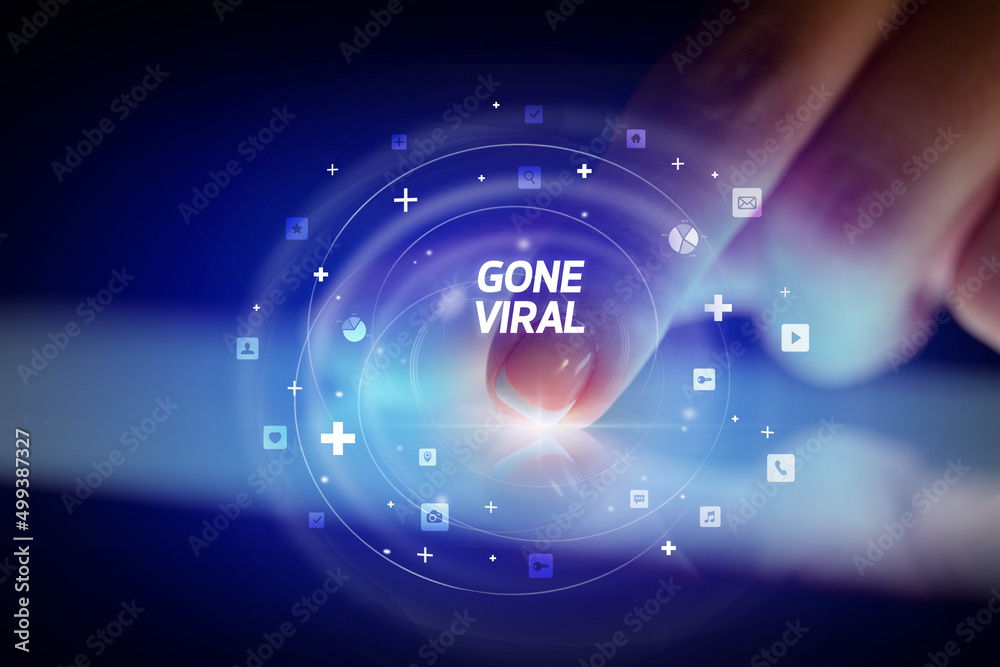 Finger touching tablet with social media icons concept Finger touching tablet with social media icons concept