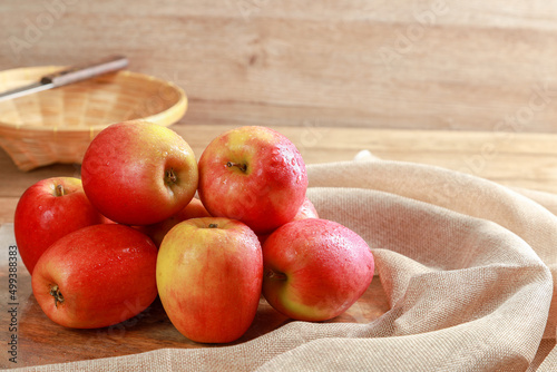 Canvas Print Closeup group of fresh Jazz Apples on wooden board background, Fruits concept