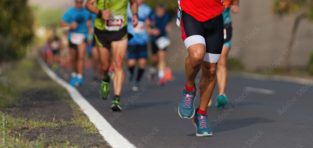 Marathon running race, people running on city road