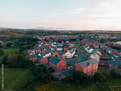 Drone shot of a suburb in north Wales with mountain in the background