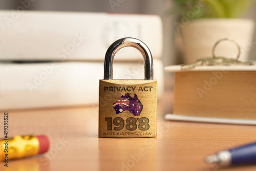 Australia privacy act 1988 concept: a lock with the australian flag on a desk