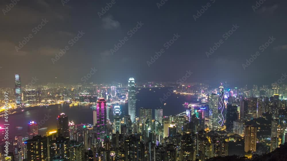 Hong Kong city skyline aerial timelapse at night with Victoria Harbor and skyscrapers Hong Kong city skyline aerial timelapse at night with Victoria Harbor and skyscrapers