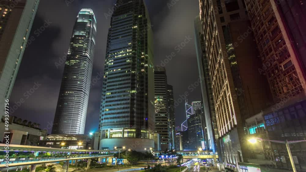 Hong Kong Business District with busy traffic timelapse at night. Hong Kong Business District with busy traffic timelapse at night.