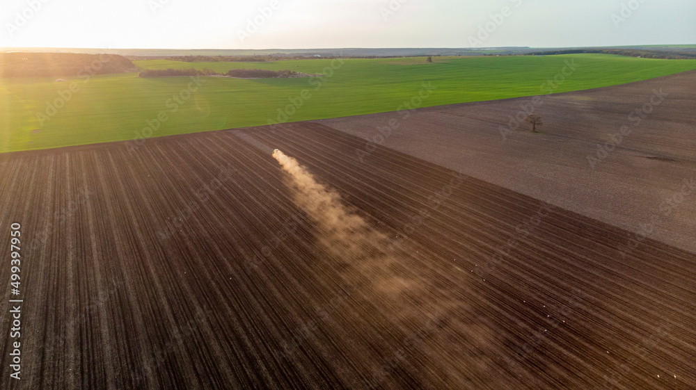 Spring Cultivation of Agricultural Land at sunset Spring Cultivation of Agricultural Land at sunset