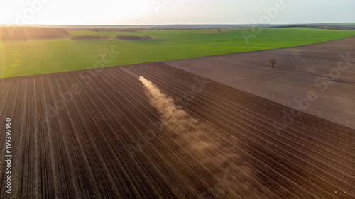 Spring Cultivation of Agricultural Land at sunset