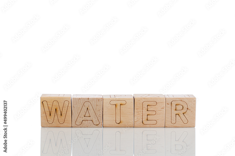 Wooden cubes with letters water on a white background