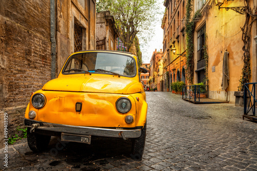 Vintage yellow car on the street of Rome, Italy. Rome architecture and landmark. © Vladimir Sazonov