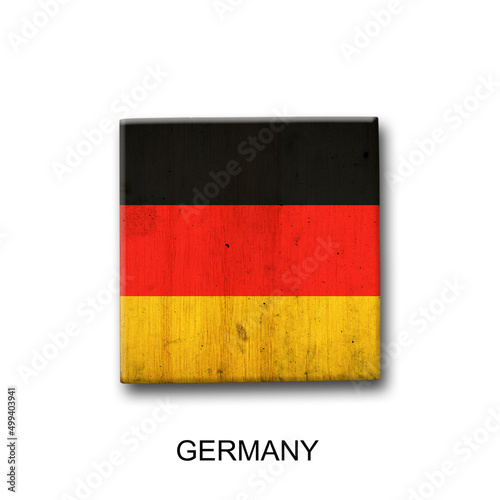 Germany flag on a wooden block. Isolated on white background. Signs and symbols.