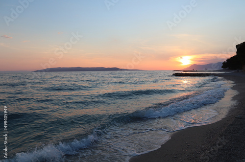 Fototapeta Naklejka Na Ścianę i Meble -  Picturesque sunset on the beach on the coast of Croatia, Dalmatia, Makarska