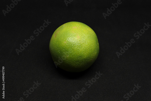 closeup shot sweet lime(citrus fruit) mosambi. with black background photo