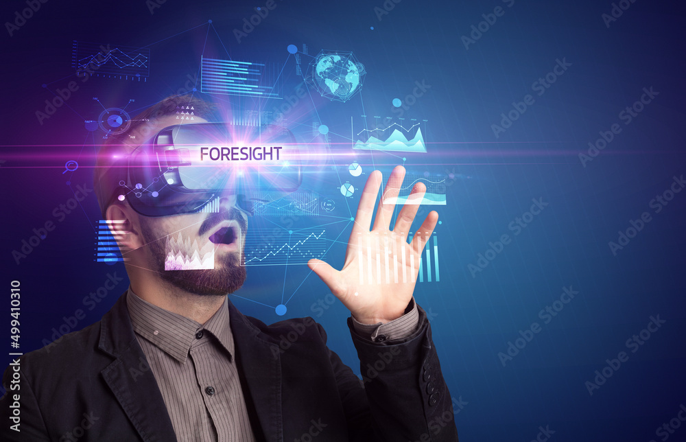 Businessman looking through Virtual Reality glasses Businessman looking through Virtual Reality glasses
