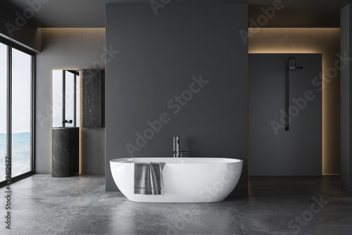 Dark grey bathroom with white bathtub and two sinks with square mirrors and shower area. Black minimalist design of modern bathroom. 3D rendering