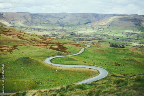 The Peak District National Park, overlooking a winding road through green hills