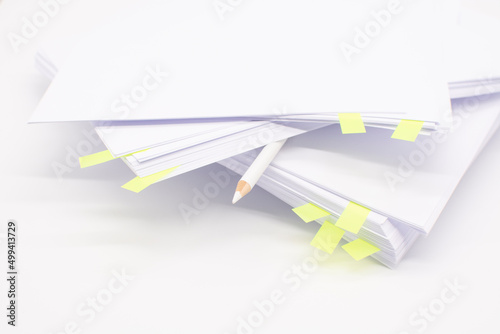 a stack of white office paper on the desktop. Business concept