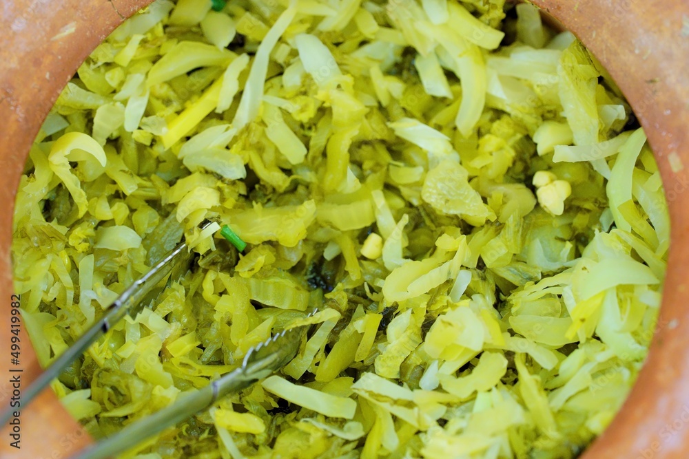 Φωτογραφία Close up of Pickled Mustard Green, thai street food market