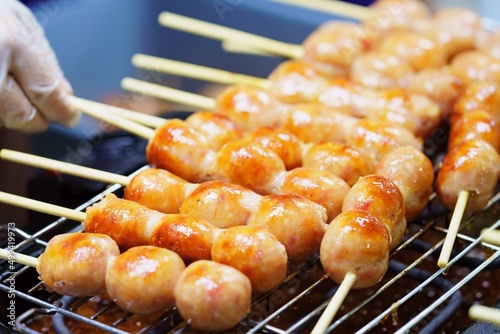 Close up of sausage grilled Thai traditional style, Sai krok isan, pork and rice, thai street food market photo