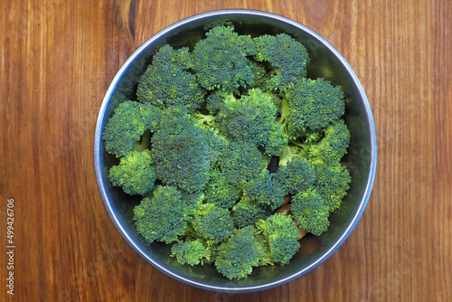 Sorted broccoli in a bowl on the table top ... 
