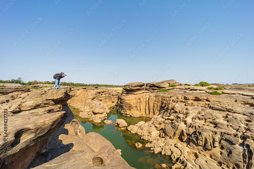 Kaeng Chom Dao or Chom Dao Beach with tourists taking pictures, Ubon Ratchathani, Thailand.