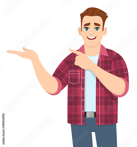 Handsome stylish young man showing hand and pointing finger to copy space. Smiling person in casual dress introducing something. Trendy male character illustration. Modern lifestyle in vector cartoon.