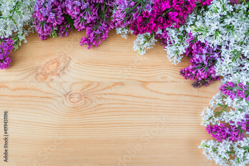 Colorful lilac flowers on wooden background