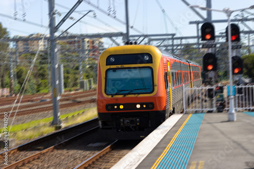 Commuter train approaching a train station in Sydney NSW Australia