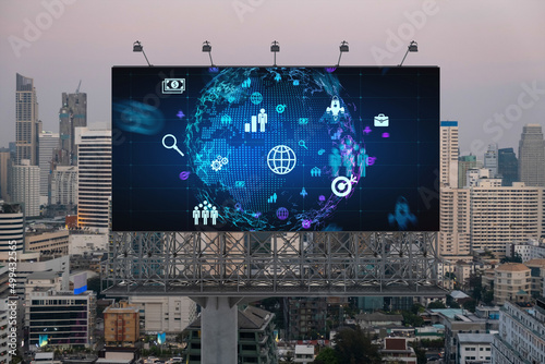 World planet Earth map hologram of social media icons over sunset panoramic cityscape of Bangkok, Southeast Asia. The concept of people connections.