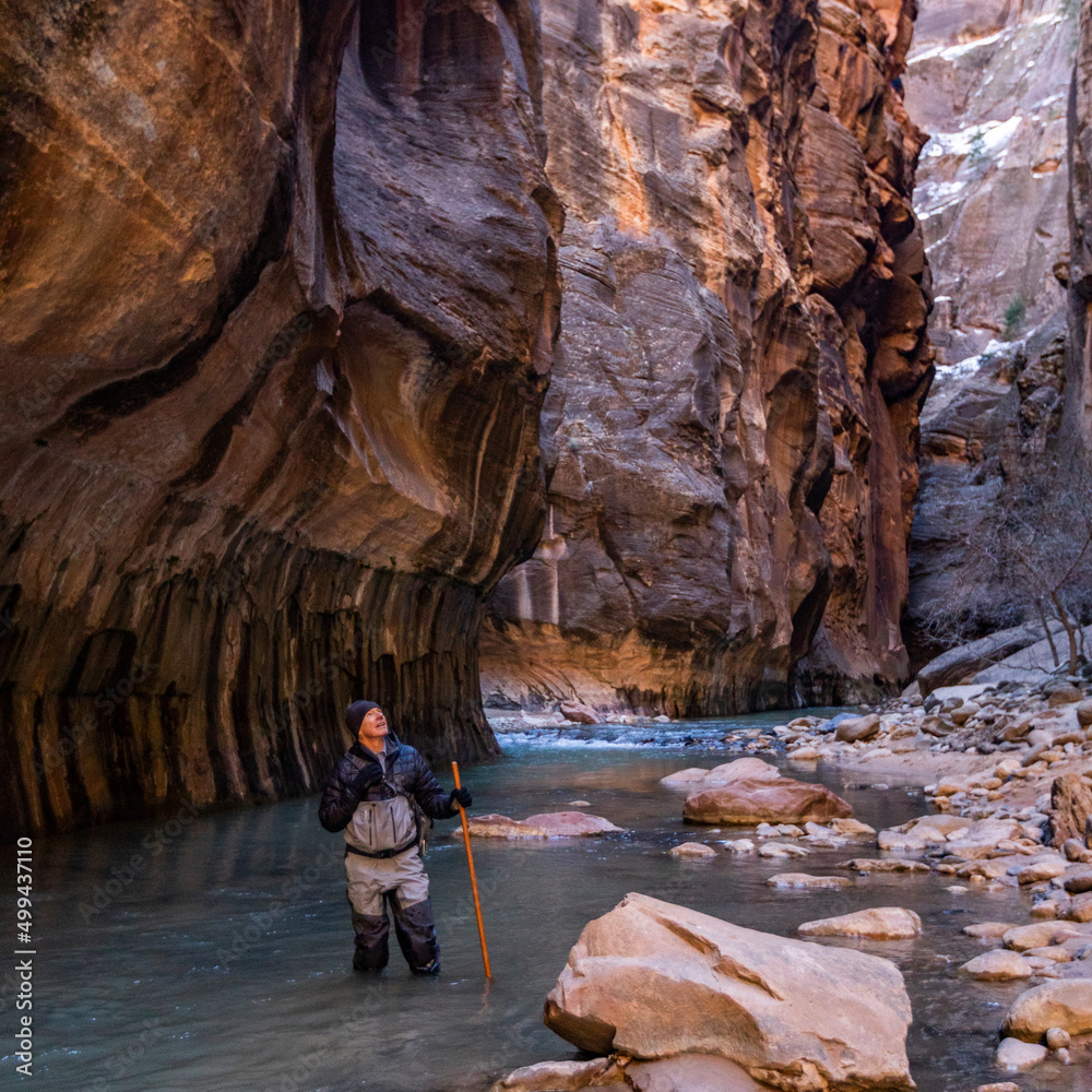 United States, Utah, Zion National Park, Senior hiker wading The