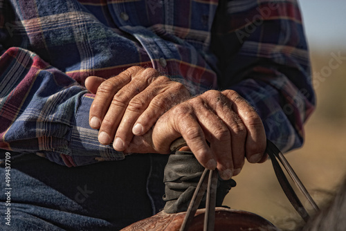 Close-up of cowboys hands