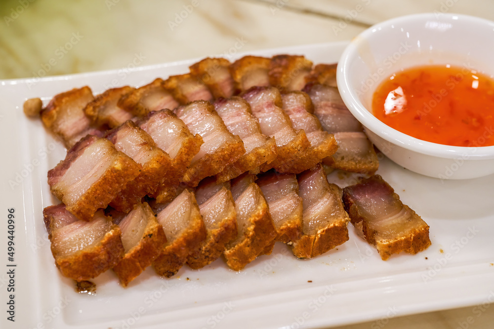 A crispy and delicious Chinese traditional Cantonese dish with crispy skin and pork belly A crispy and delicious Chinese traditional Cantonese dish with crispy skin and pork belly