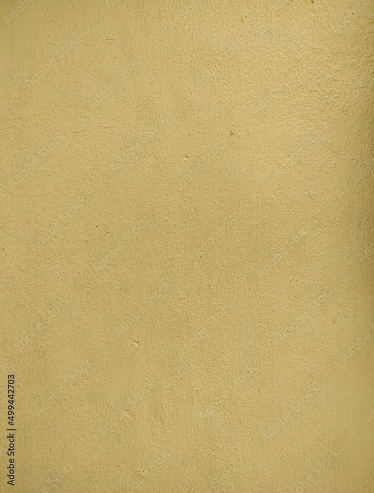 Texture cement wall painted yellow rough background, surface cement wall painted yellow for decoration. Texture cement wall painted yellow rough background, surface cement wall painted yellow for decoration.
