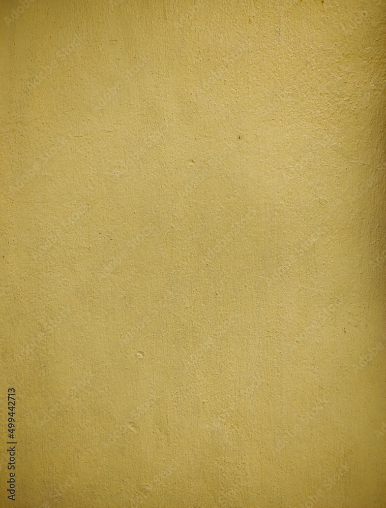 Texture cement wall painted yellow rough background, surface cement wall painted yellow for decoration. Texture cement wall painted yellow rough background, surface cement wall painted yellow for decoration.