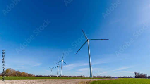 wind turbine on a green field © Jurand
