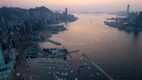 sunset view of victoria harbour between Tsim Sha Tsui and Hong Kong Island