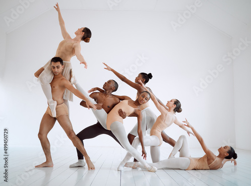 Through dance, we can present a solid story. Shot of a group of ballet dancers practicing a routine in a dance studio.