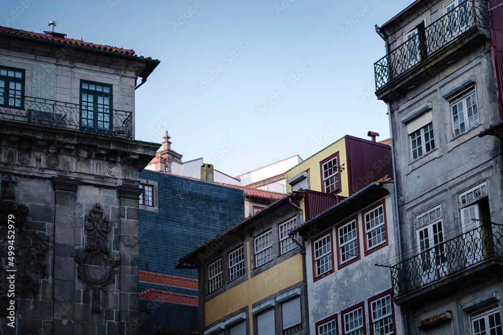 View of the facades of buildings in the historic center of Porto, Portugal.