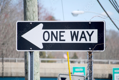 Fotografie ONE WAY (arrow) Directional Street Sign Close-Up