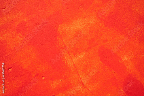 irregular stucco wall painted red or orange