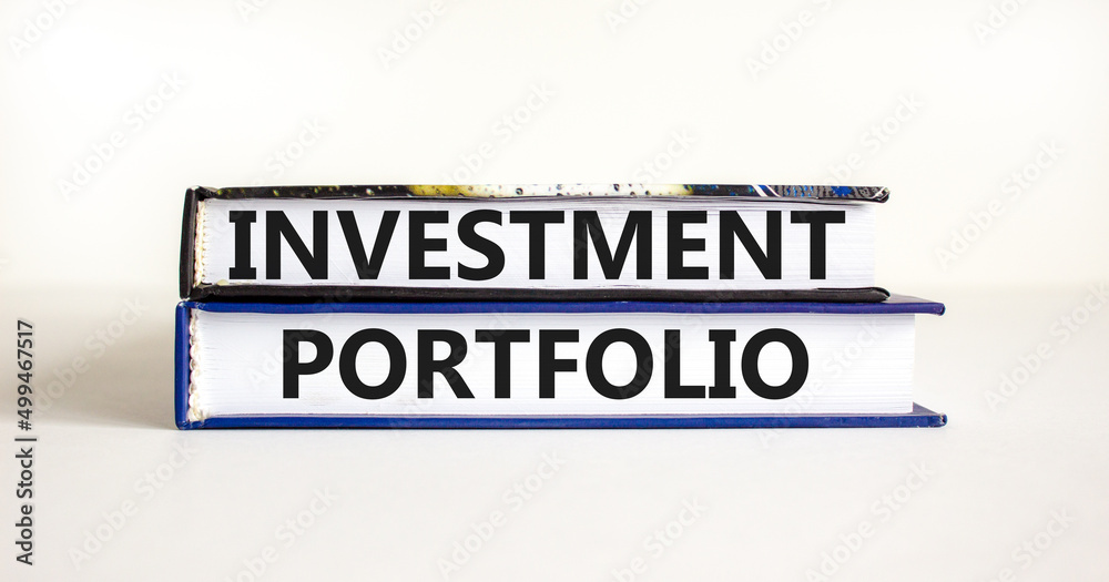 Investment portfolio symbol. Books with concept words Investment portfolio on beautiful white background. Business investment portfolio concept. Copy space.