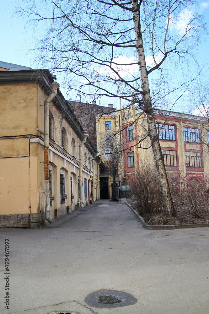 Old two-story yellow house in the city center Old two-story yellow house in the city center